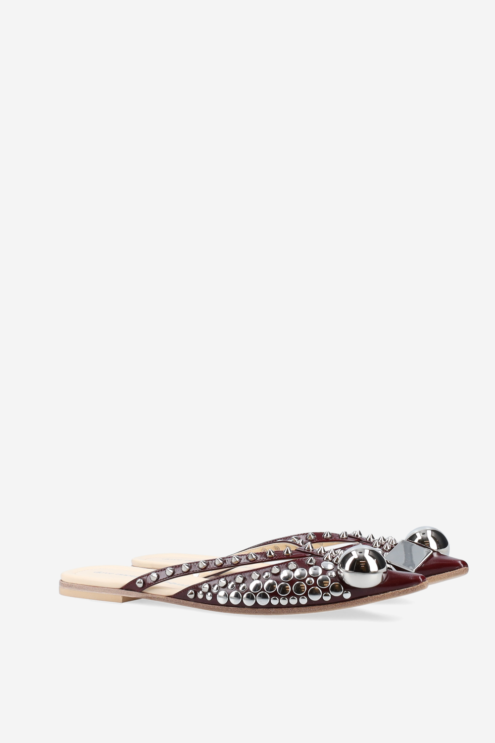 Rock studded patent leather mules