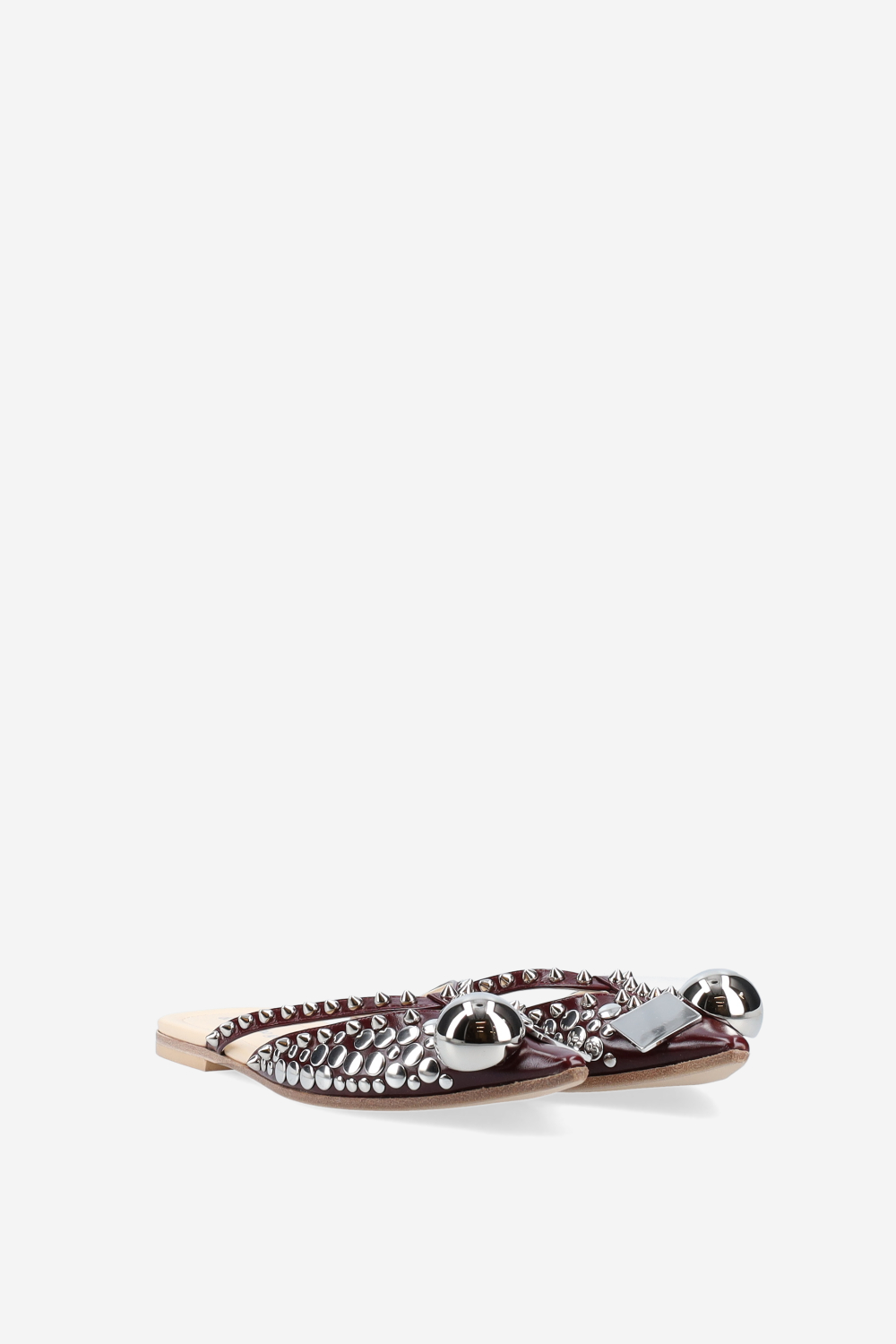 Rock studded patent leather mules