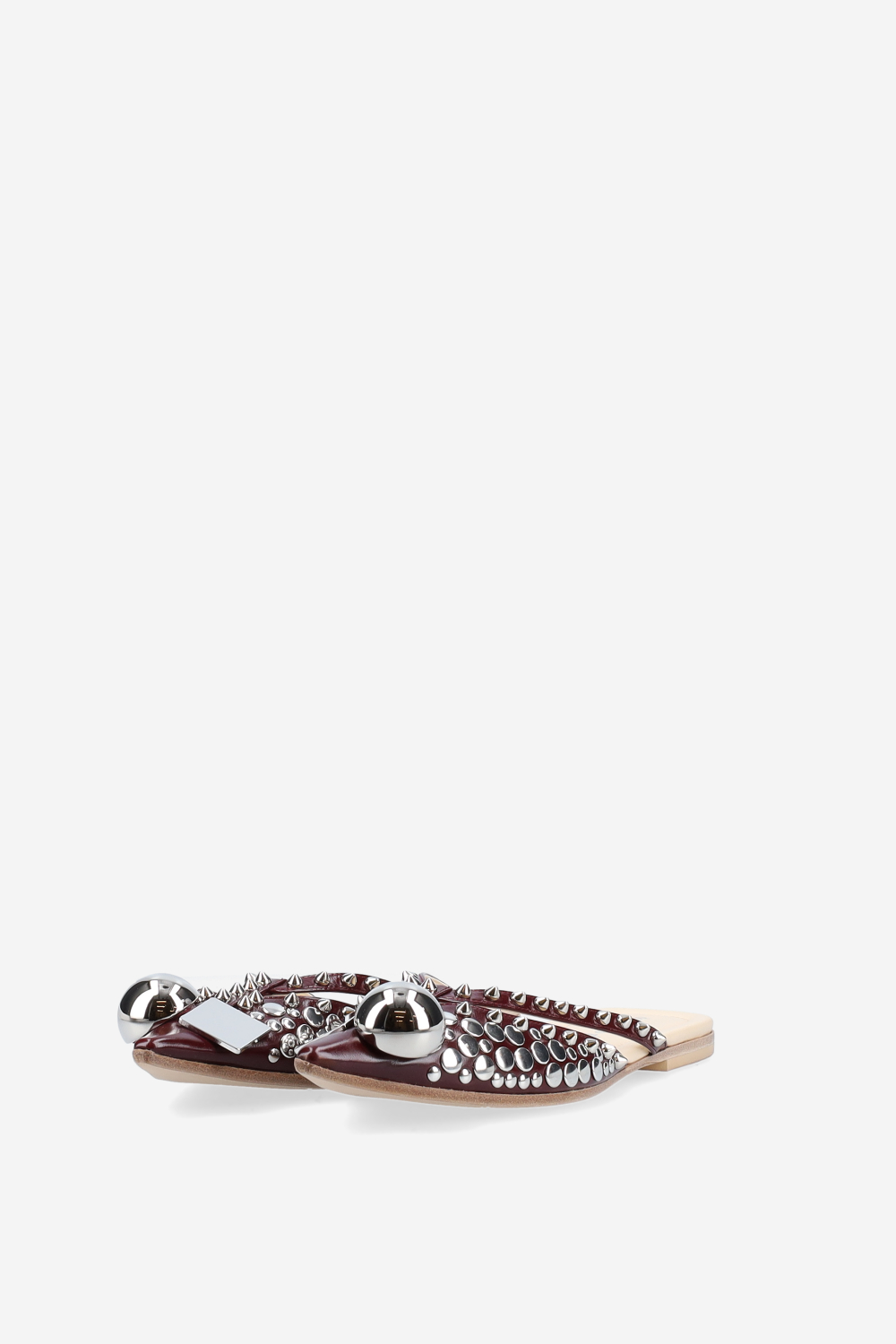 Rock studded patent leather mules