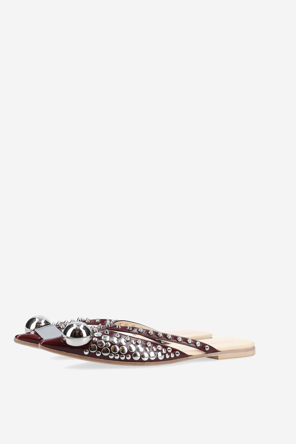 Rock studded patent leather mules