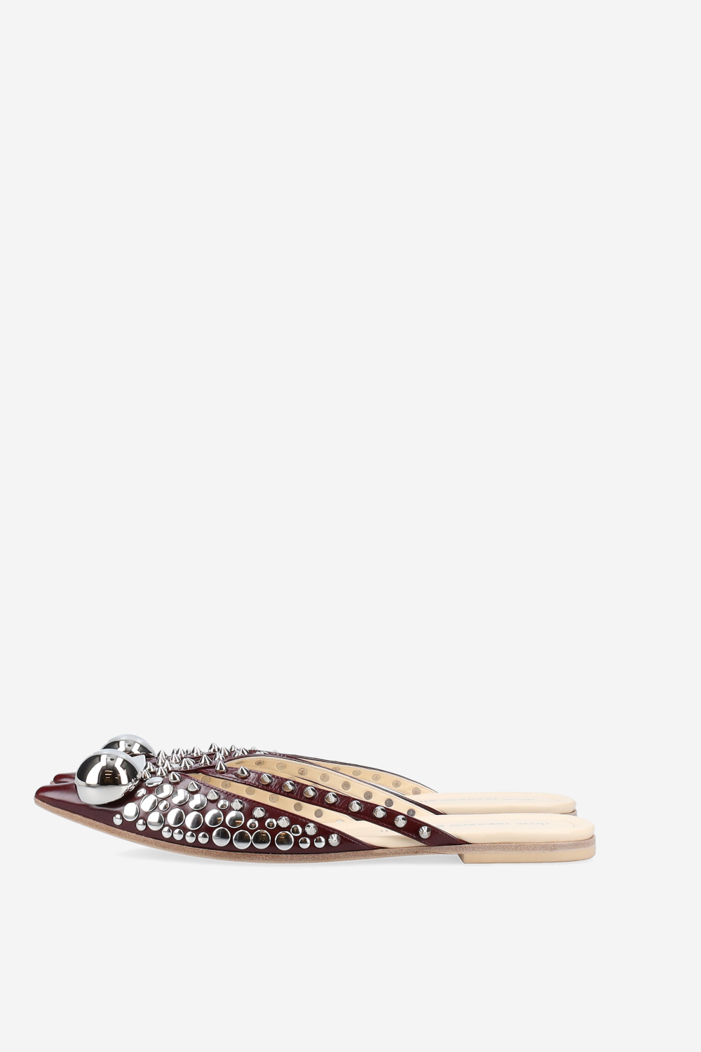 Rock studded patent leather mules