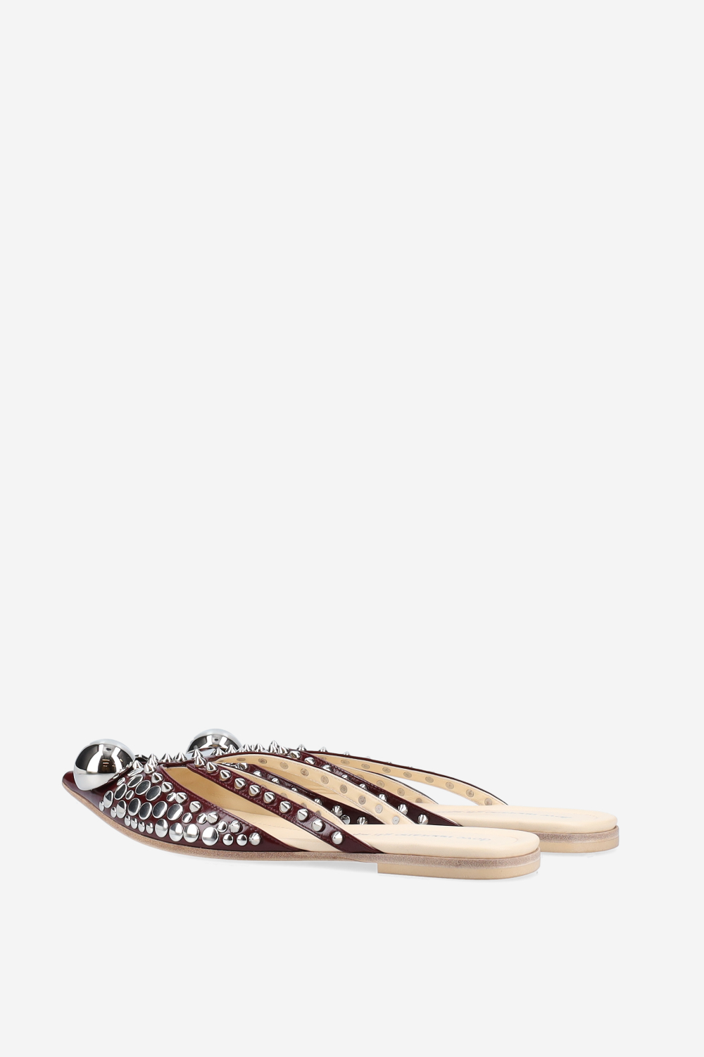 Rock studded patent leather mules