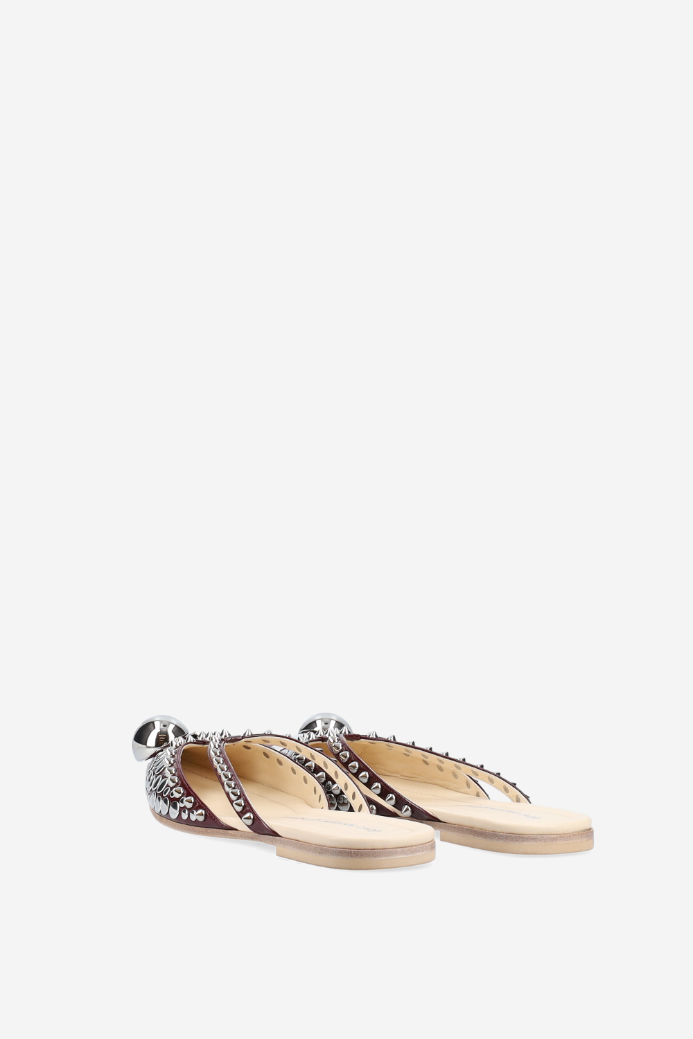 Rock studded patent leather mules