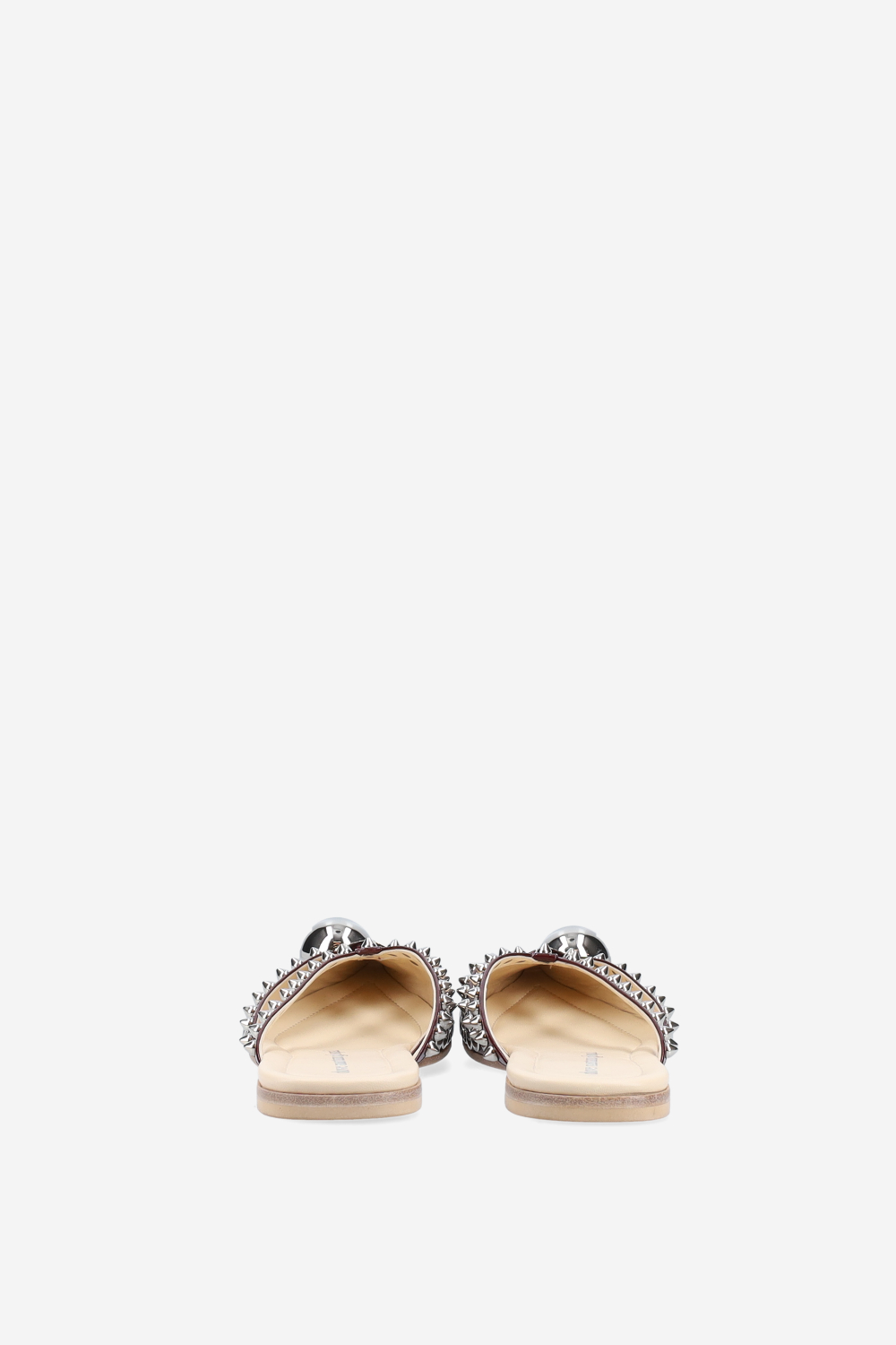 Rock studded patent leather mules