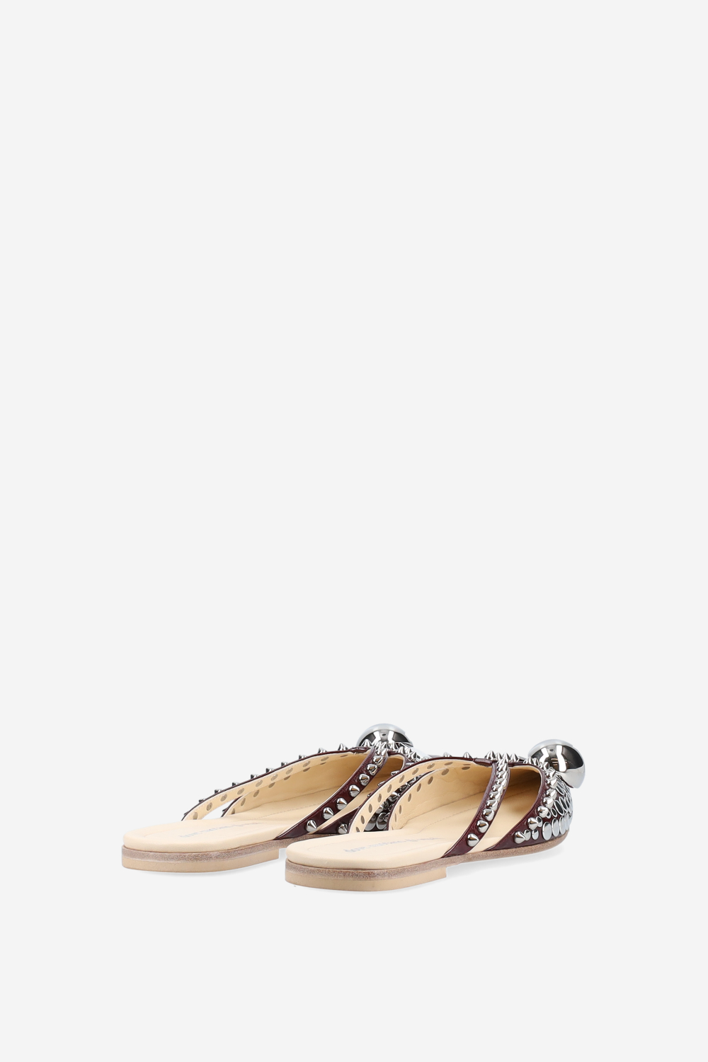 Rock studded patent leather mules
