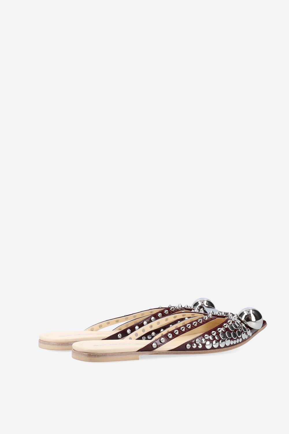 Rock studded patent leather mules