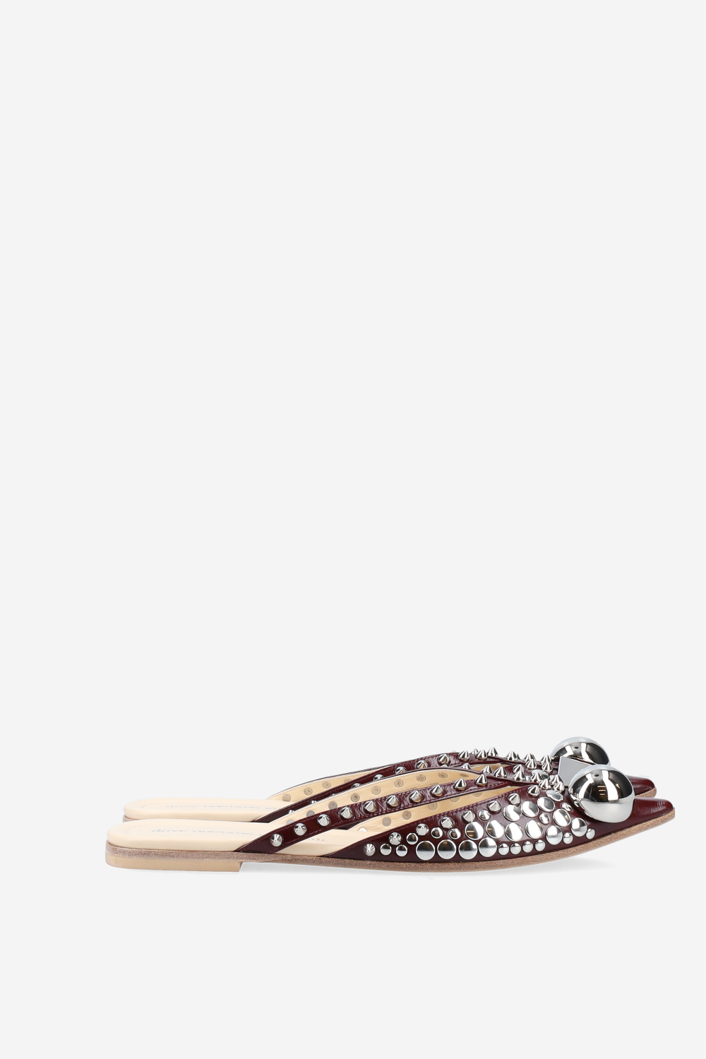 Rock studded patent leather mules